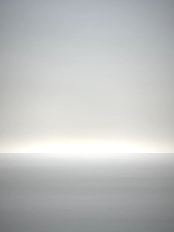 Almost white sea and sky with a faint horizon